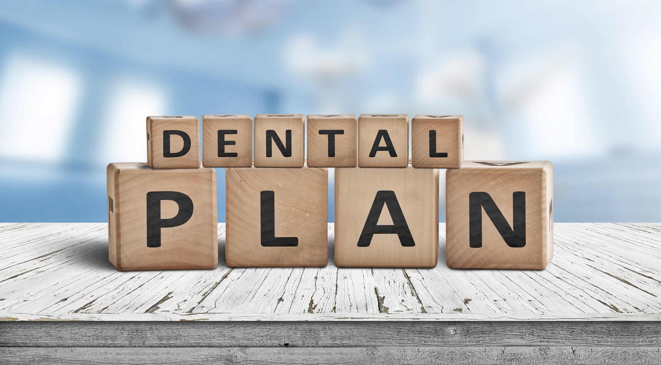 Dental Plan Sign With A Blue Room In The Background